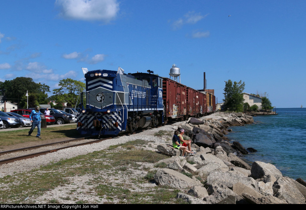 Locals walk past the 1501 to get to the water